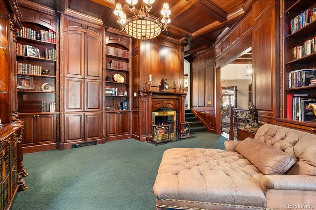 a living room with furniture and large windows