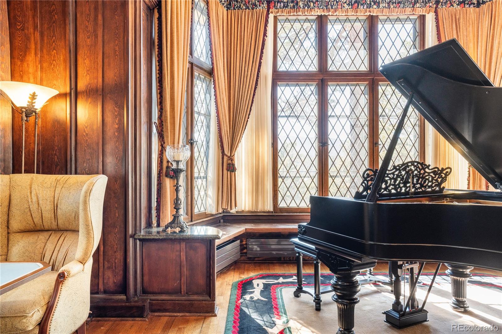 222 Greystone Road Evergreen, CO 80439 - Photo 26 of 31 a living room with furniture and large windows