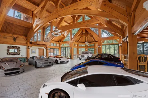 a view of a cars park in front of a building