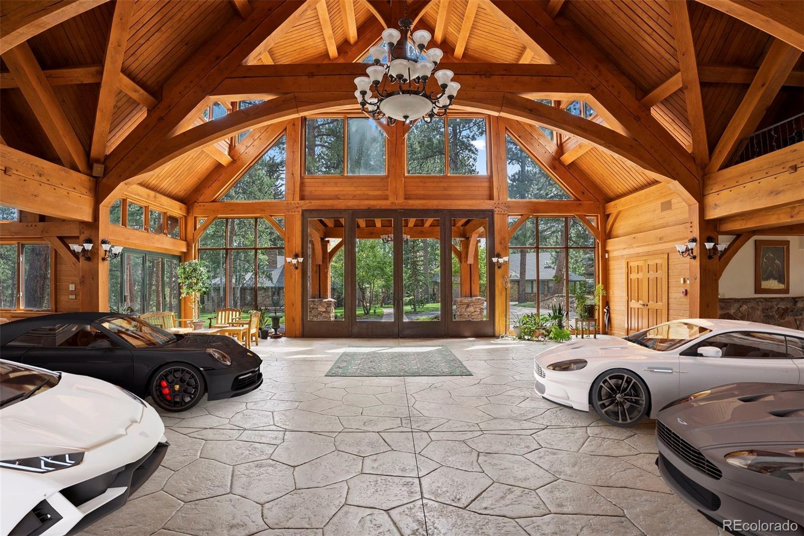 222 Greystone Road Evergreen, CO 80439 - Photo 30 of 31 a view of a cars park in front of a building