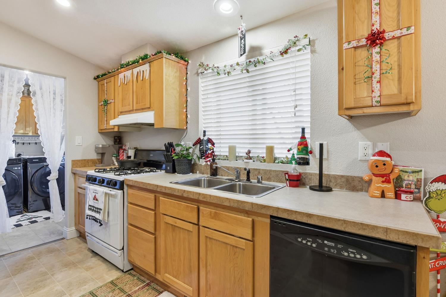 1160 Pleasant Valley Road Diamond Springs, CA 95619 - Photo 11 of 42 a kitchen with stainless steel appliances granite countertop a sink stove and cabinets