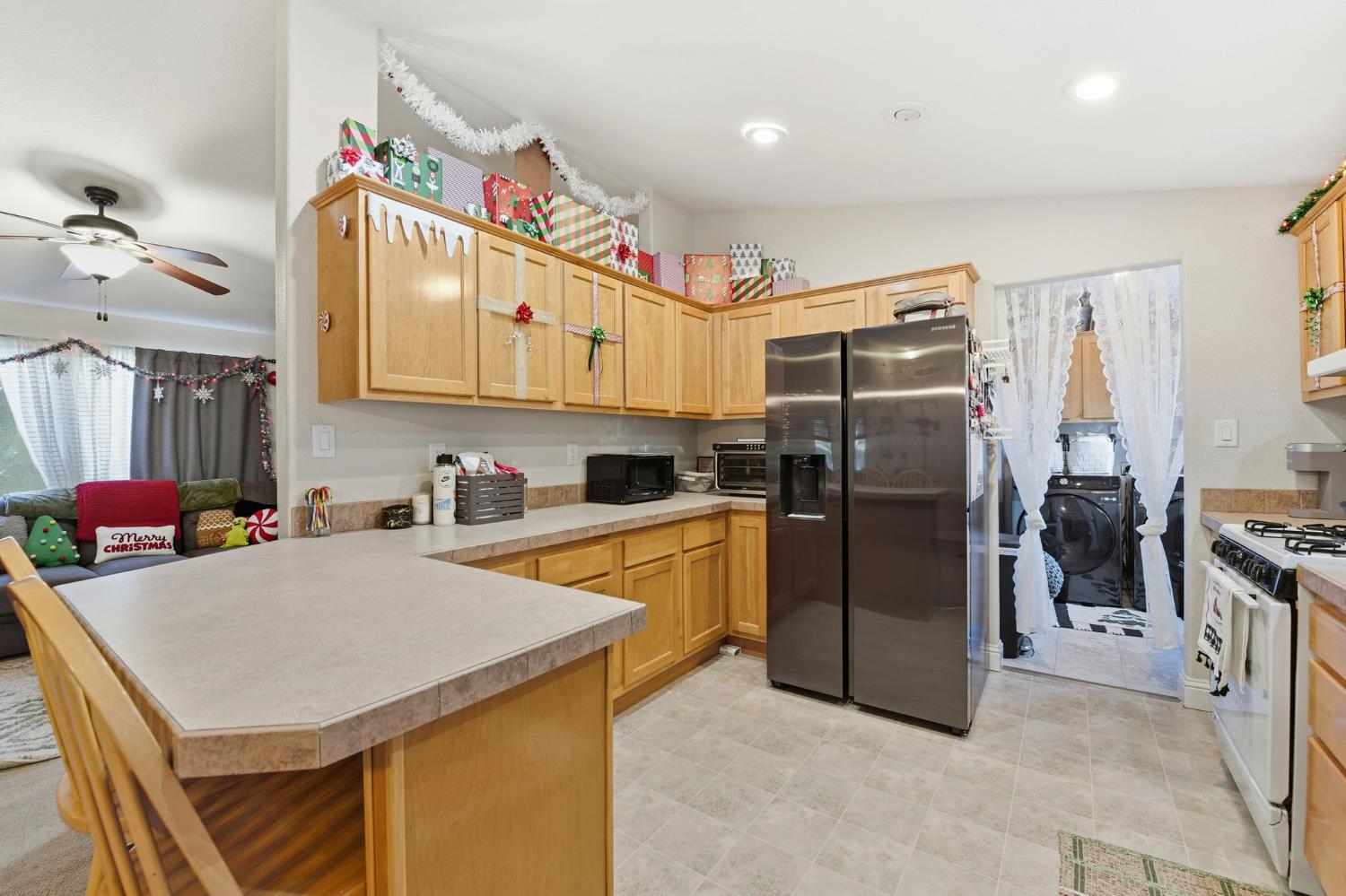1160 Pleasant Valley Road Diamond Springs, CA 95619 - Photo 12 of 42 a kitchen with stainless steel appliances a stove refrigerator sink and cabinets