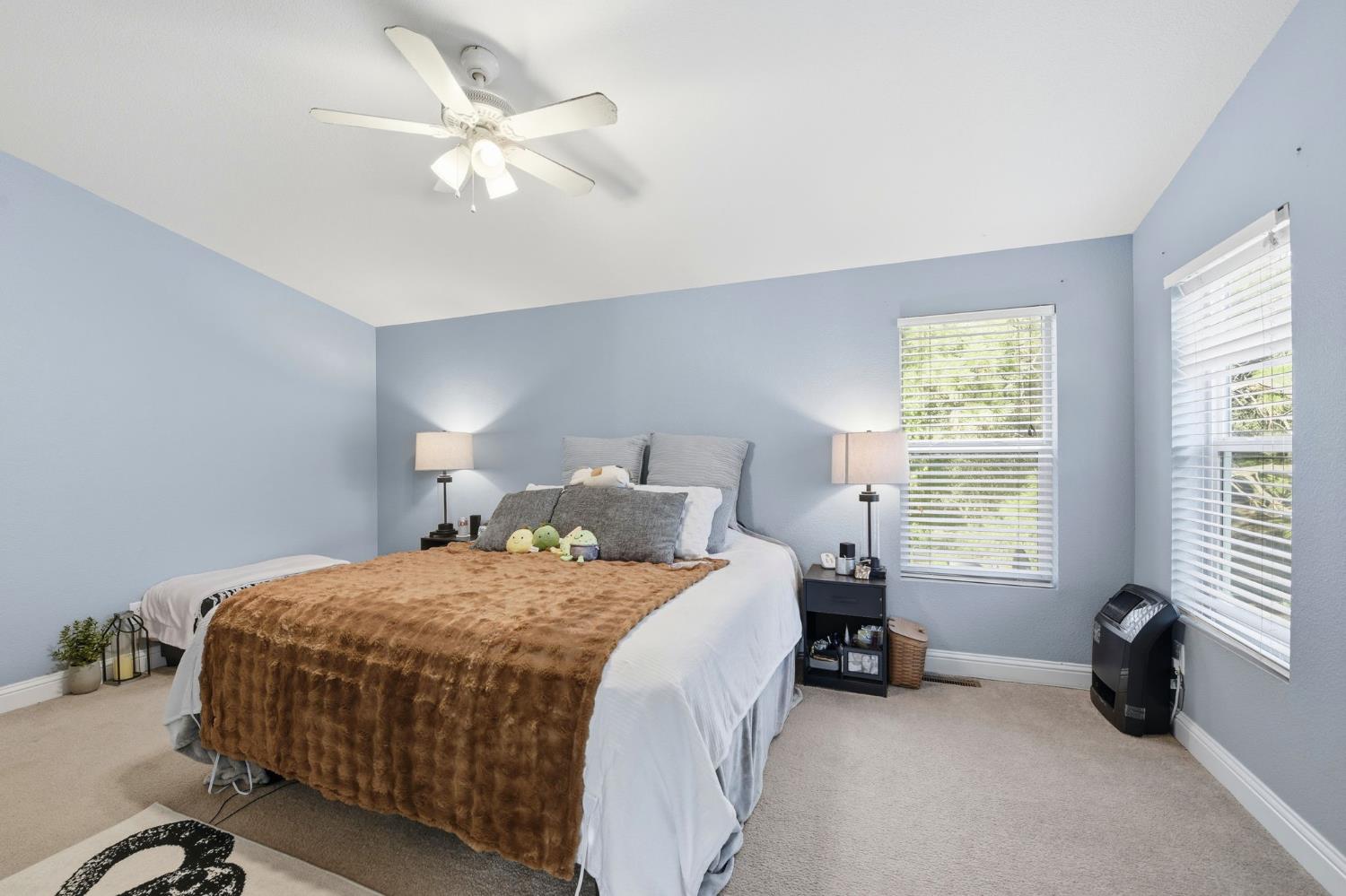 1160 Pleasant Valley Road Diamond Springs, CA 95619 - Photo 16 of 42 a bedroom with a bed and a large window