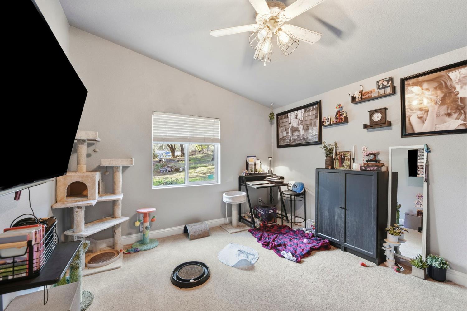 1160 Pleasant Valley Road Diamond Springs, CA 95619 - Photo 19 of 42 a view of a workspace with furniture and a window