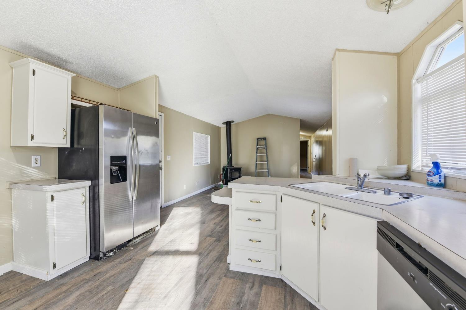 1160 Pleasant Valley Road Diamond Springs, CA 95619 - Photo 26 of 42 a spacious bathroom with a granite countertop sink mirror and cabinets