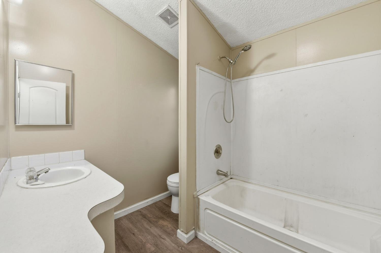 1160 Pleasant Valley Road Diamond Springs, CA 95619 - Photo 35 of 42 a bathroom with a tub and a sink