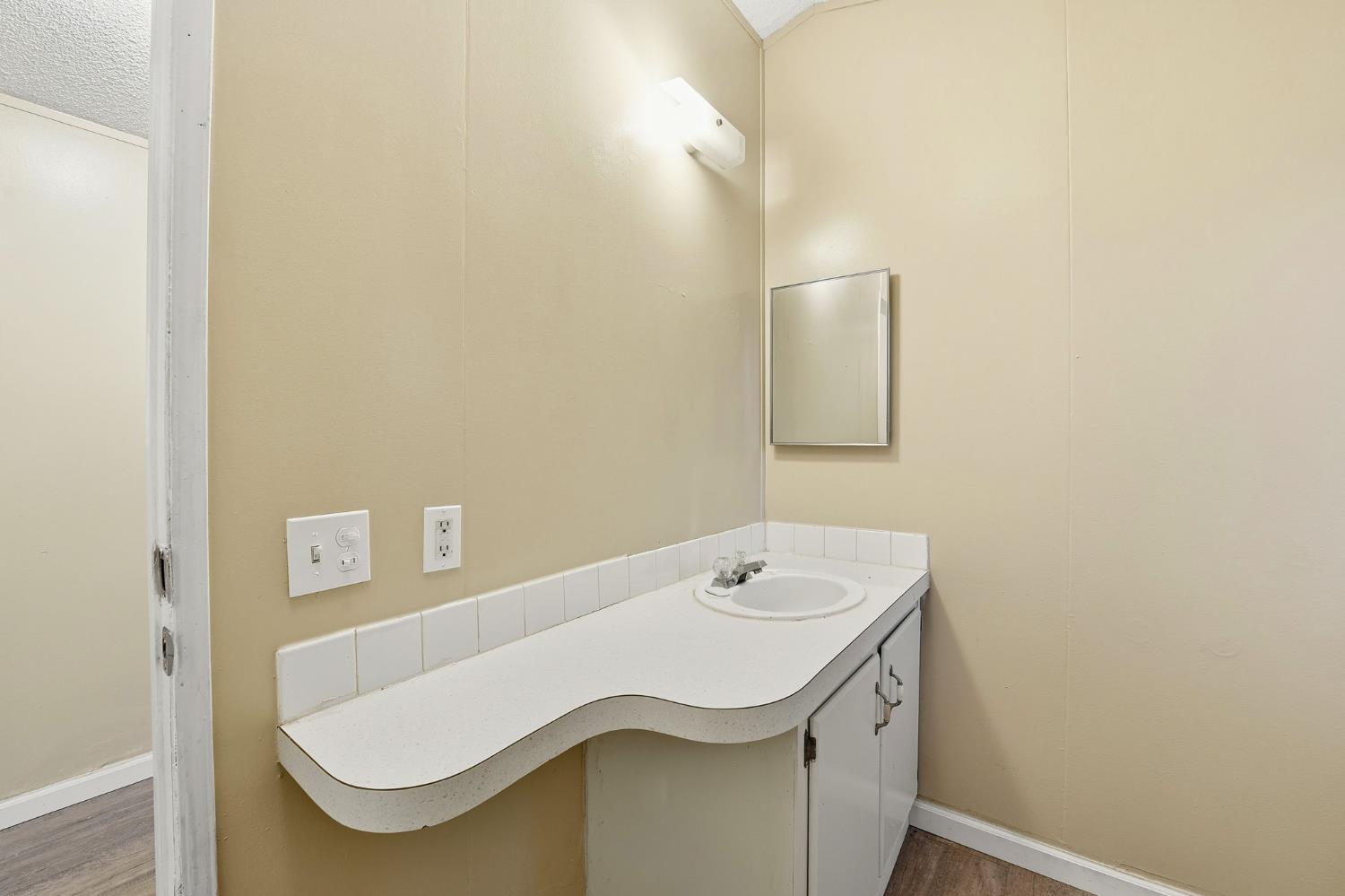 1160 Pleasant Valley Road Diamond Springs, CA 95619 - Photo 36 of 42 a bathroom with a sink and mirror