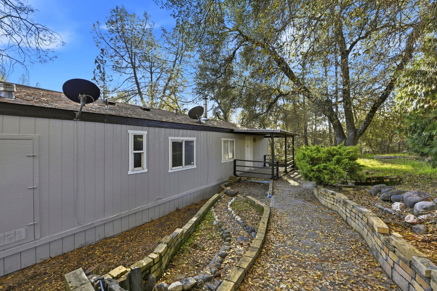 1160 Pleasant Valley Road Diamond Springs, CA 95619 - Photo 38 of 42 a backyard of a house with barbeque oven
