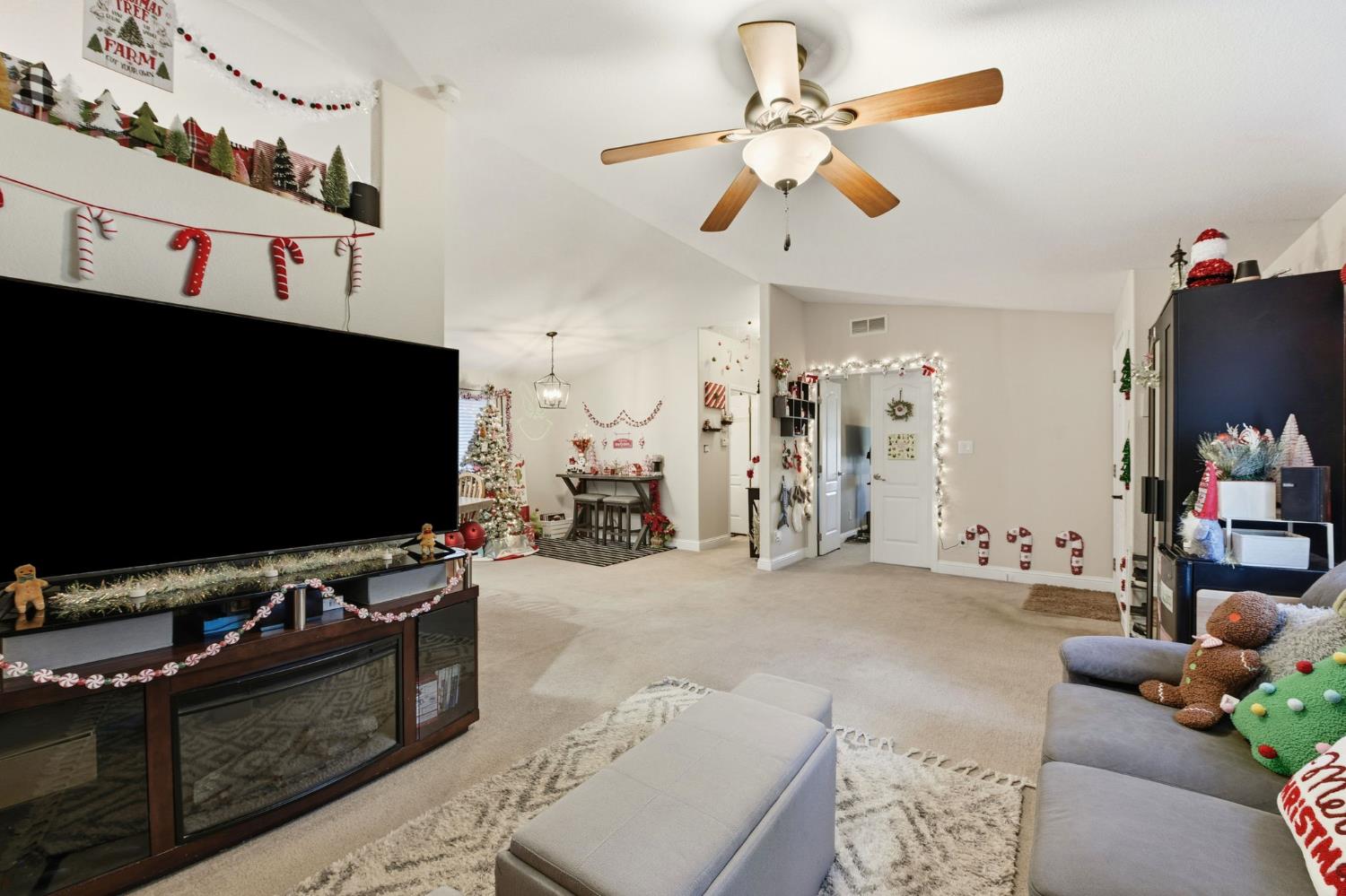 1160 Pleasant Valley Road Diamond Springs, CA 95619 - Photo 5 of 42 a living room with furniture and a flat screen tv