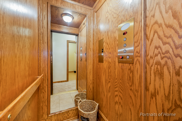 1015 Mackenzie Place Wheaton, IL 60187 - Photo 12 of 26 a bathroom with a shower curtain and sink