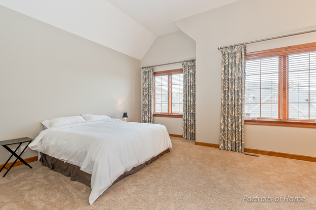 1015 Mackenzie Place Wheaton, IL 60187 - Photo 13 of 26 a bedroom with a bed and a window