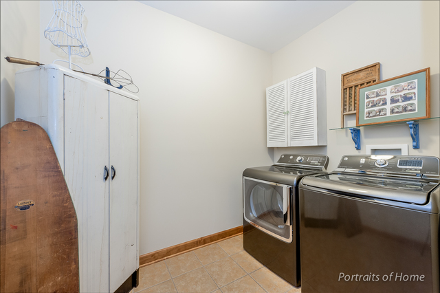 1015 Mackenzie Place Wheaton, IL 60187 - Photo 18 of 26 a view of a kitchen with stainless steel appliances wooden floor and cabinets