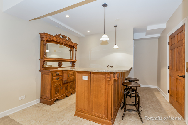 1015 Mackenzie Place Wheaton, IL 60187 - Photo 19 of 26 a view of a hallway with mirror door