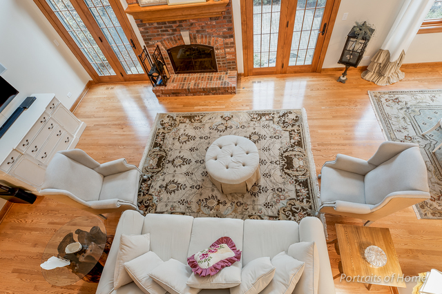 1015 Mackenzie Place Wheaton, IL 60187 - Photo 5 of 26 a living room with a rug and a couch