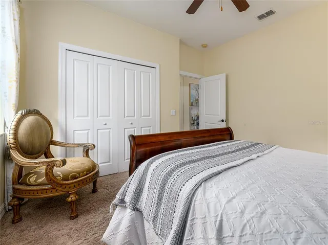 a bedroom with furniture and a window