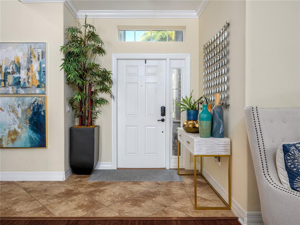 20213 Regal Fern Court Tampa, FL 33647 - Photo 3 of 65 a view of an entryway with wooden floor
