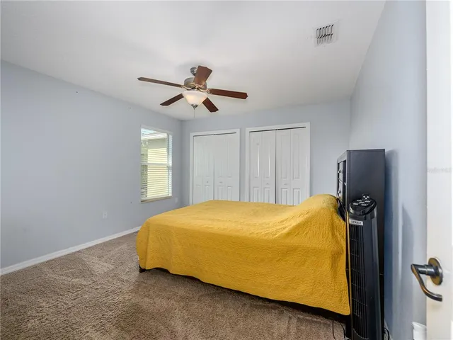 a living room with furniture pool table and a window