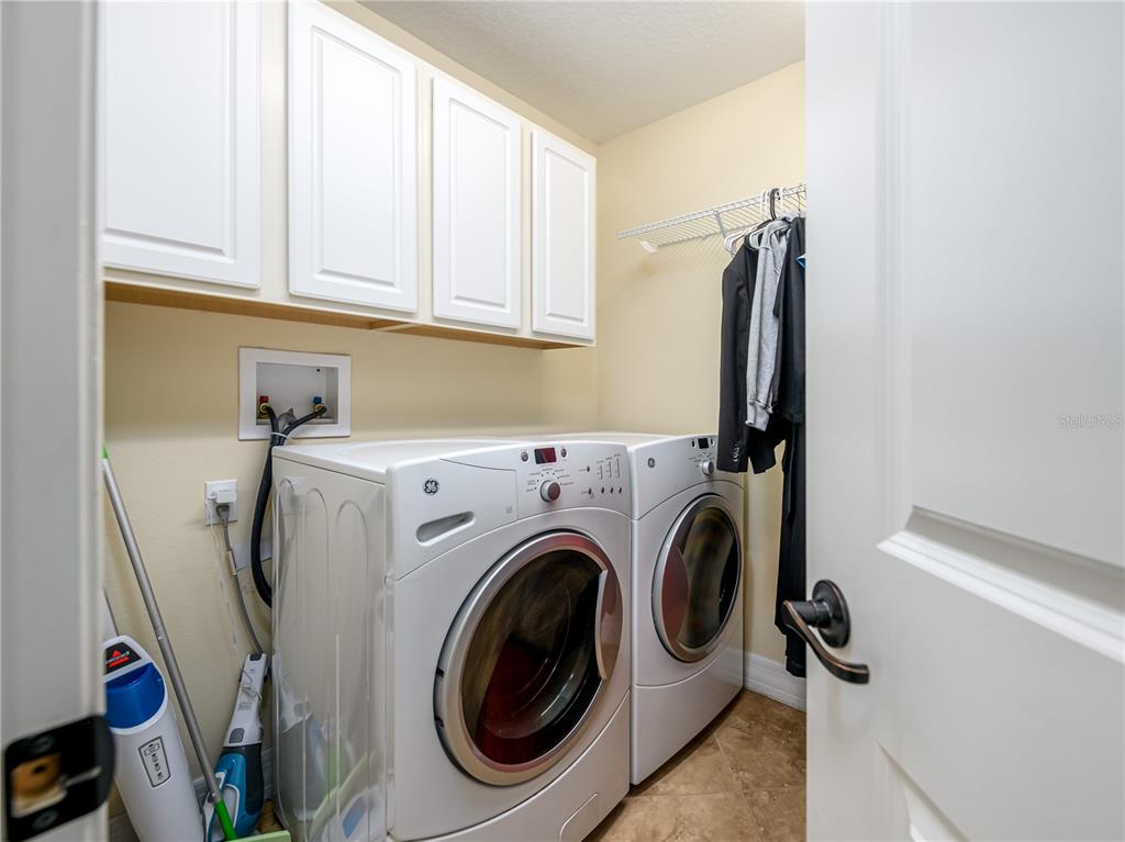 20213 Regal Fern Court Tampa, FL 33647 - Photo 37 of 65 a utility room with dryer and washer