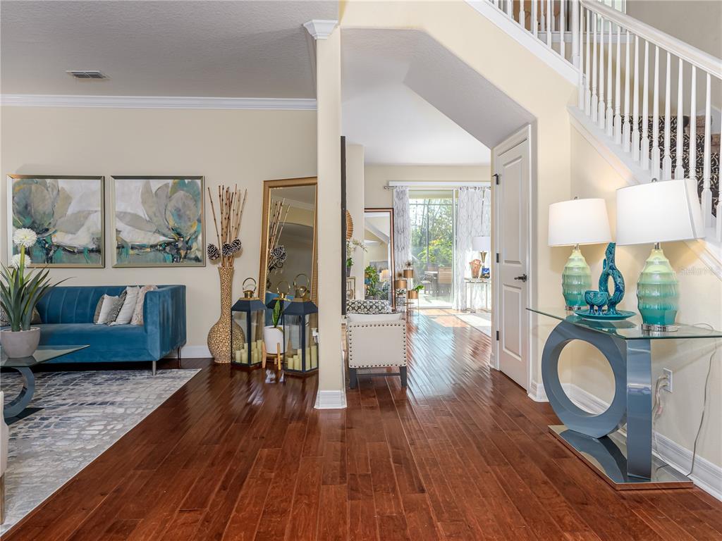 20213 Regal Fern Court Tampa, FL 33647 - Photo 4 of 65 a living room with furniture a window and wooden floor