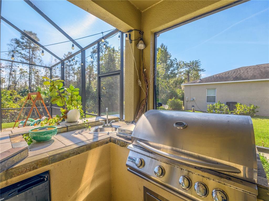 20213 Regal Fern Court Tampa, FL 33647 - Photo 44 of 65 a view of kitchen with a sink and wooden floor
