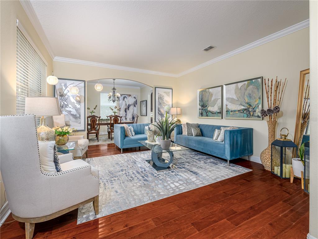 20213 Regal Fern Court Tampa, FL 33647 - Photo 5 of 65 a kitchen with a table chairs refrigerator and couch