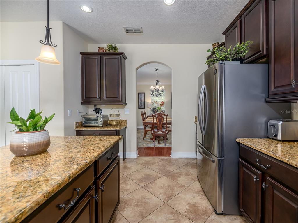 20213 Regal Fern Court Tampa, FL 33647 - Photo 10 of 65 a kitchen with stainless steel appliances granite countertop a refrigerator a stove and a sink