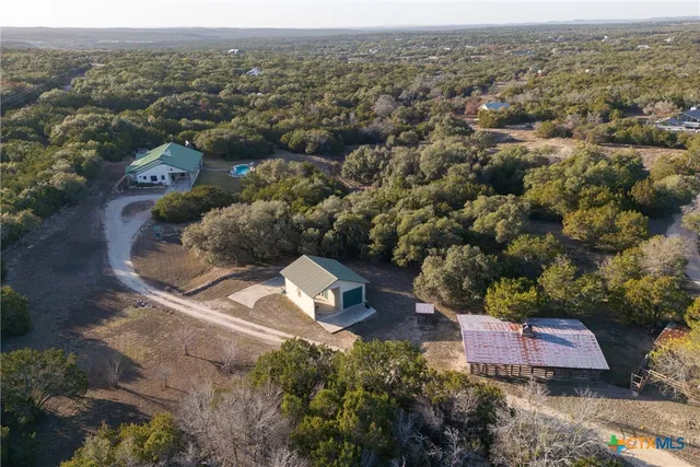 an aerial view of residential house with outdoor space