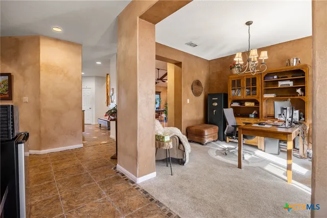 a view of a livingroom with furniture and windows