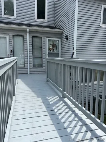 a view of a house with wooden deck