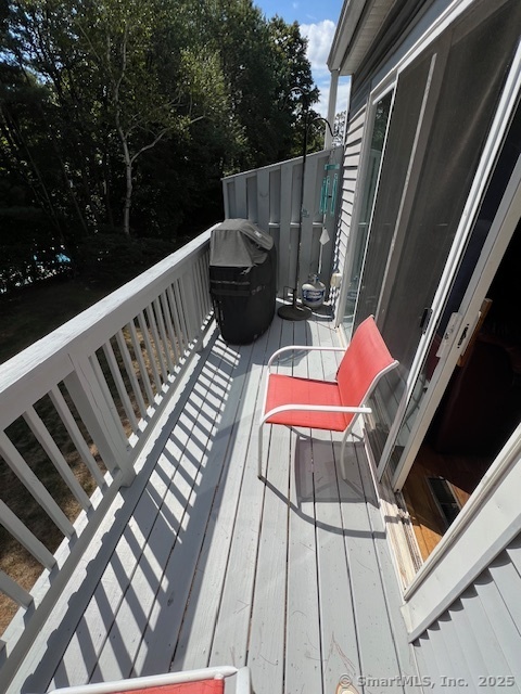 7 Pheasant Run, Unit 7 Cromwell, CT 06416 - Photo 18 of 20 a view of deck with chairs and wooden fence