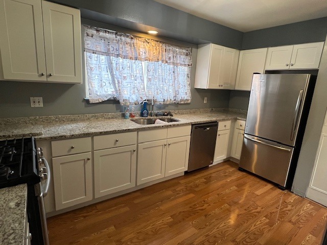 7 Pheasant Run, Unit 7 Cromwell, CT 06416 - Photo 8 of 20 a kitchen with stainless steel appliances granite countertop a refrigerator sink and white cabinets