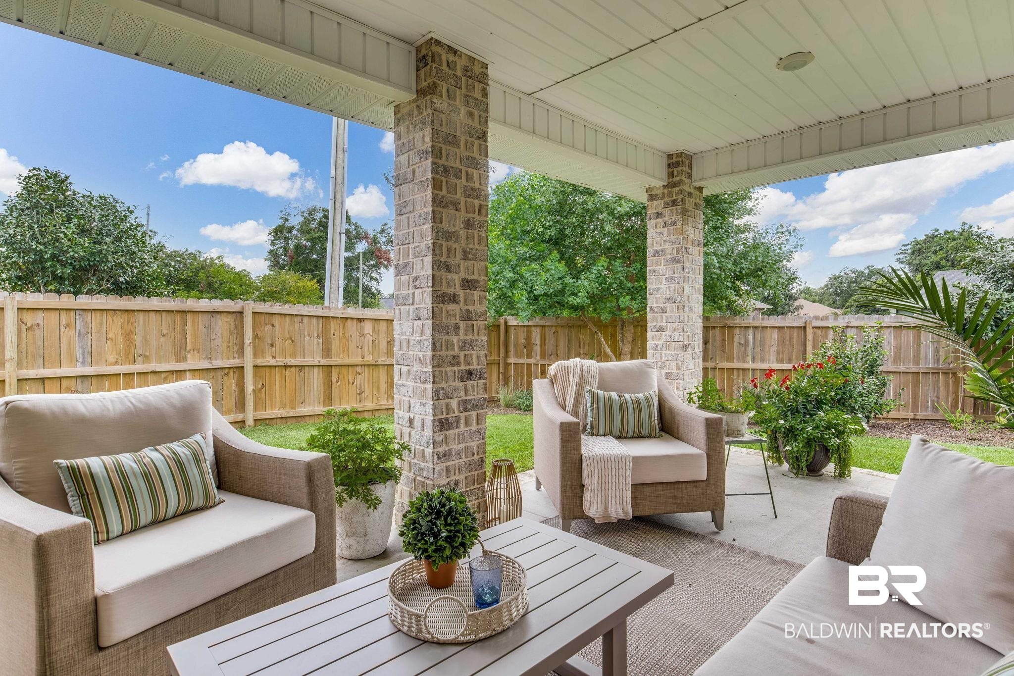 2222 Club House Drive Lillian, AL 36549 - Photo 26 of 49 Fenced backyard featuring an outdoor hangout area and a patio area