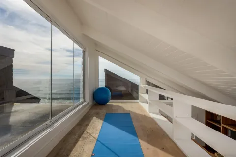 a view of a bathroom with a tub and shower