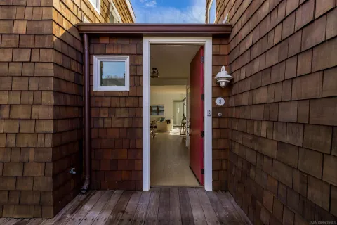 a view of a garden with a building in the background