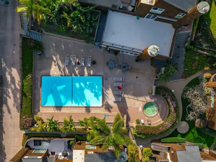 a swimming pool with outdoor seating and yard