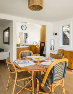 a dining room with a table and chairs