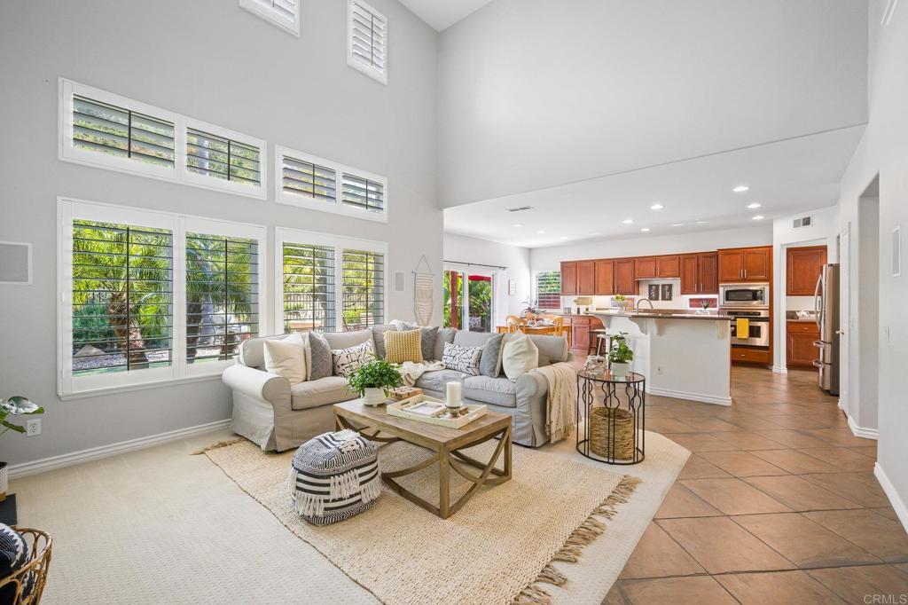 2107 Sun Valley Road San Marcos, CA 92078 - Photo 11 of 41 a living room with furniture and a table with kitchen view