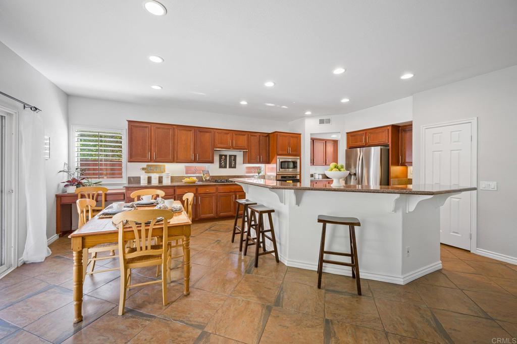 2107 Sun Valley Road San Marcos, CA 92078 - Photo 13 of 41 a living room with lots of white furniture and kitchen view