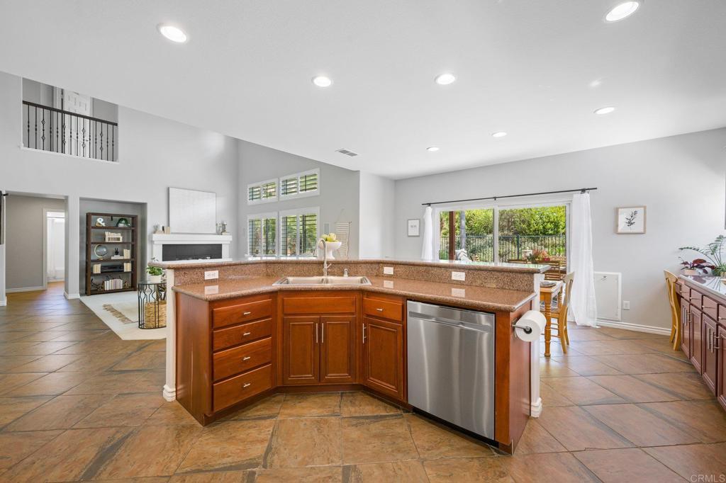 2107 Sun Valley Road San Marcos, CA 92078 - Photo 17 of 41 a kitchen with stainless steel appliances granite countertop a sink and cabinets