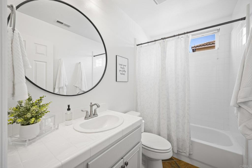 2107 Sun Valley Road San Marcos, CA 92078 - Photo 19 of 41 a bathroom with a sink toilet and a mirror
