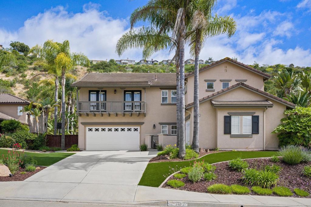 2107 Sun Valley Road San Marcos, CA 92078 - Photo 2 of 41 a front view of a house with a garden and a yard