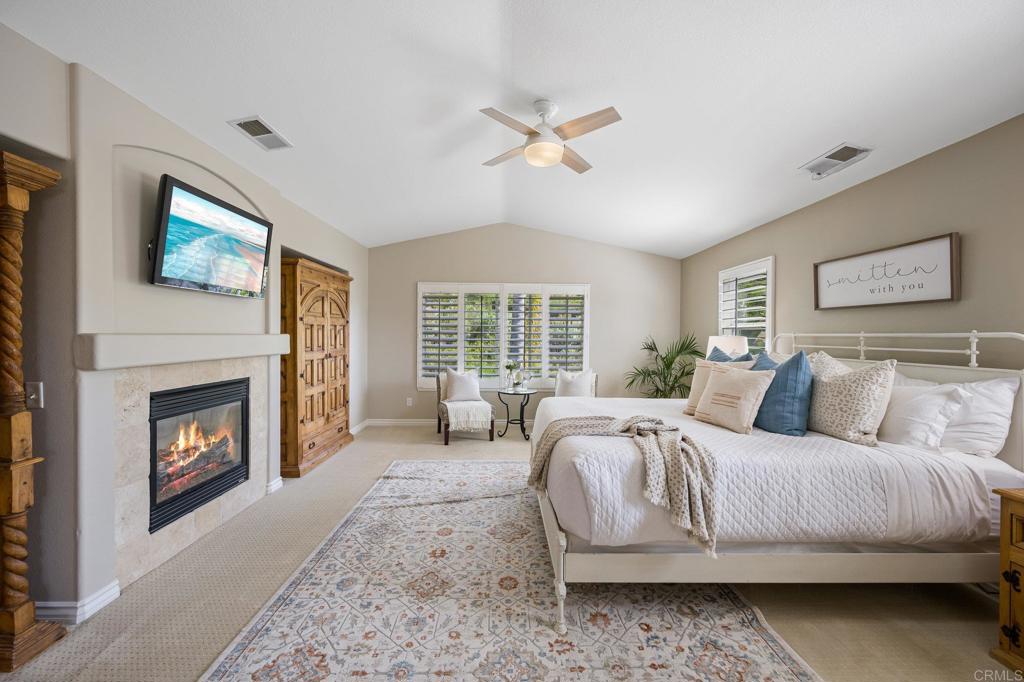 2107 Sun Valley Road San Marcos, CA 92078 - Photo 22 of 41 a spacious bedroom with a bed and a fireplace