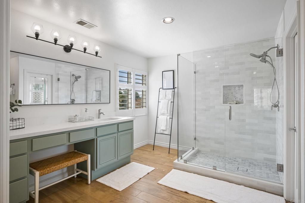 2107 Sun Valley Road San Marcos, CA 92078 - Photo 25 of 41 a bathroom with a double vanity sink mirror and shower