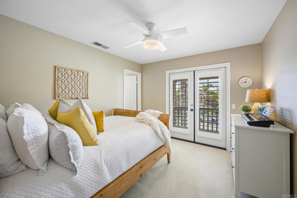 2107 Sun Valley Road San Marcos, CA 92078 - Photo 28 of 41 a spacious bedroom with a bed and a large window