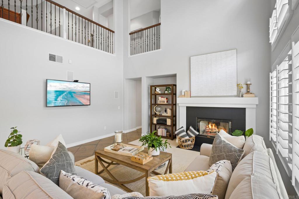 2107 Sun Valley Road San Marcos, CA 92078 - Photo 10 of 41 a living room with furniture a fireplace and a large window