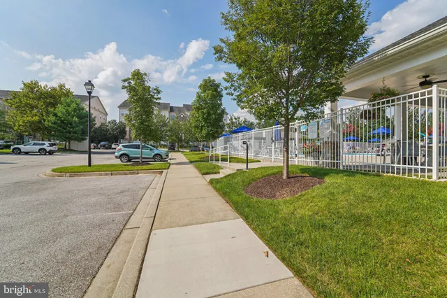 a view of swimming pool with sitting area and garden