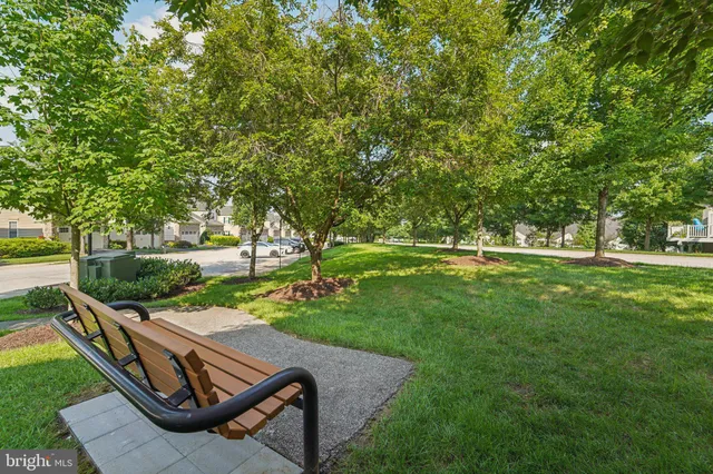 a view of backyard with outdoor seating and green space