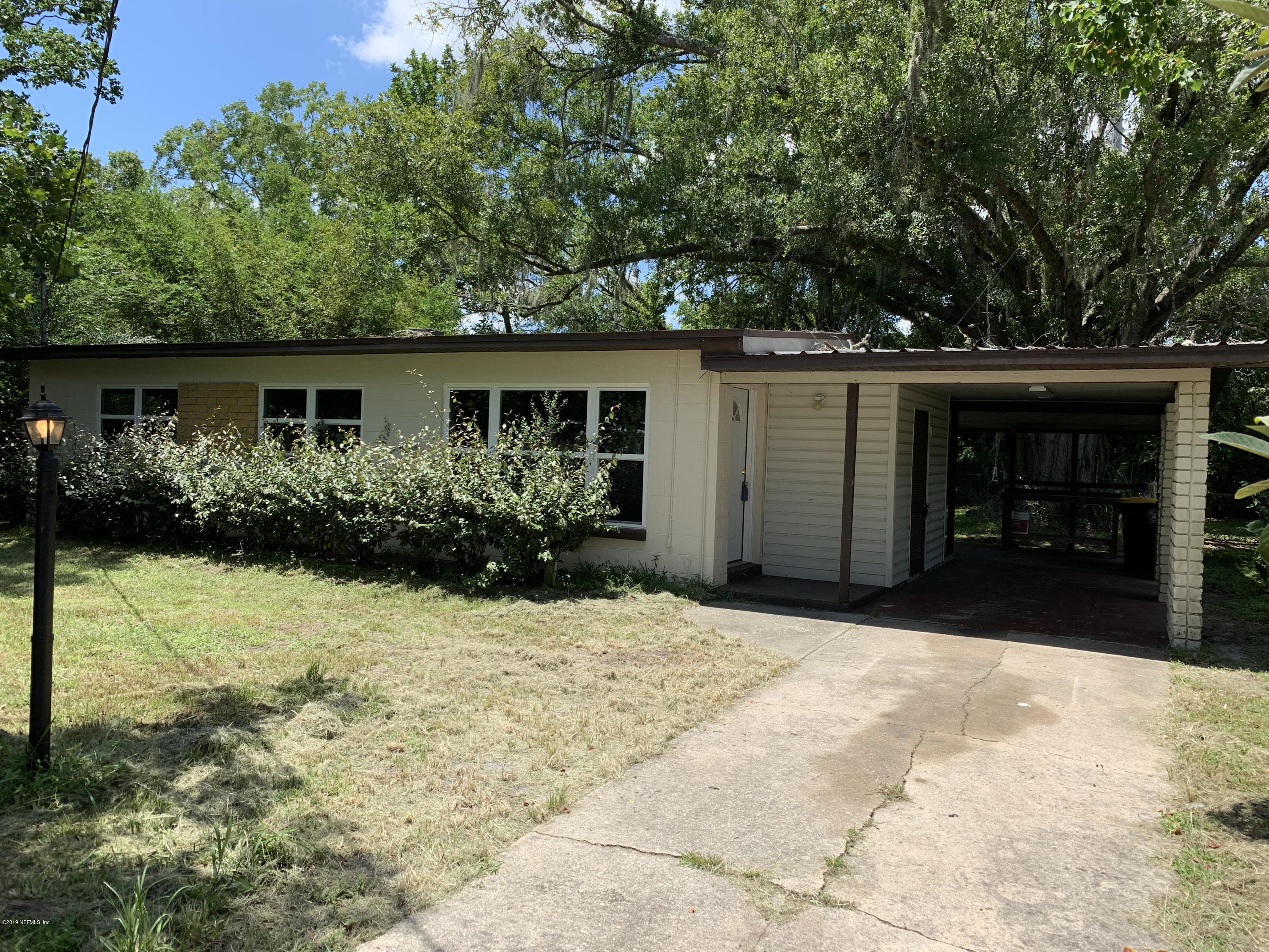 front view of house with a yard