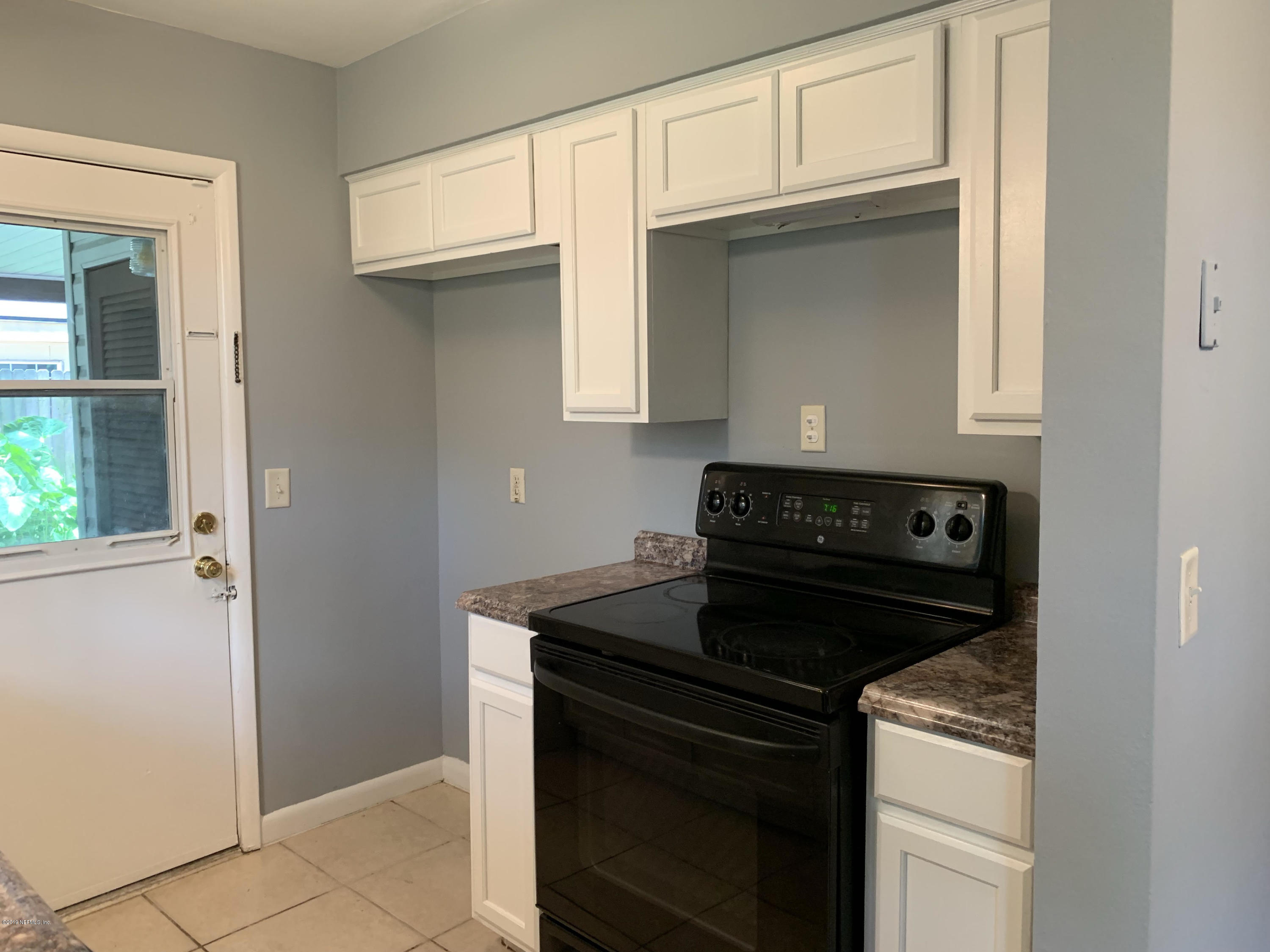 5304 Batley Road Jacksonville, FL 32210 - Photo 5 of 10 a close view of a stove top oven sitting inside of a kitchen