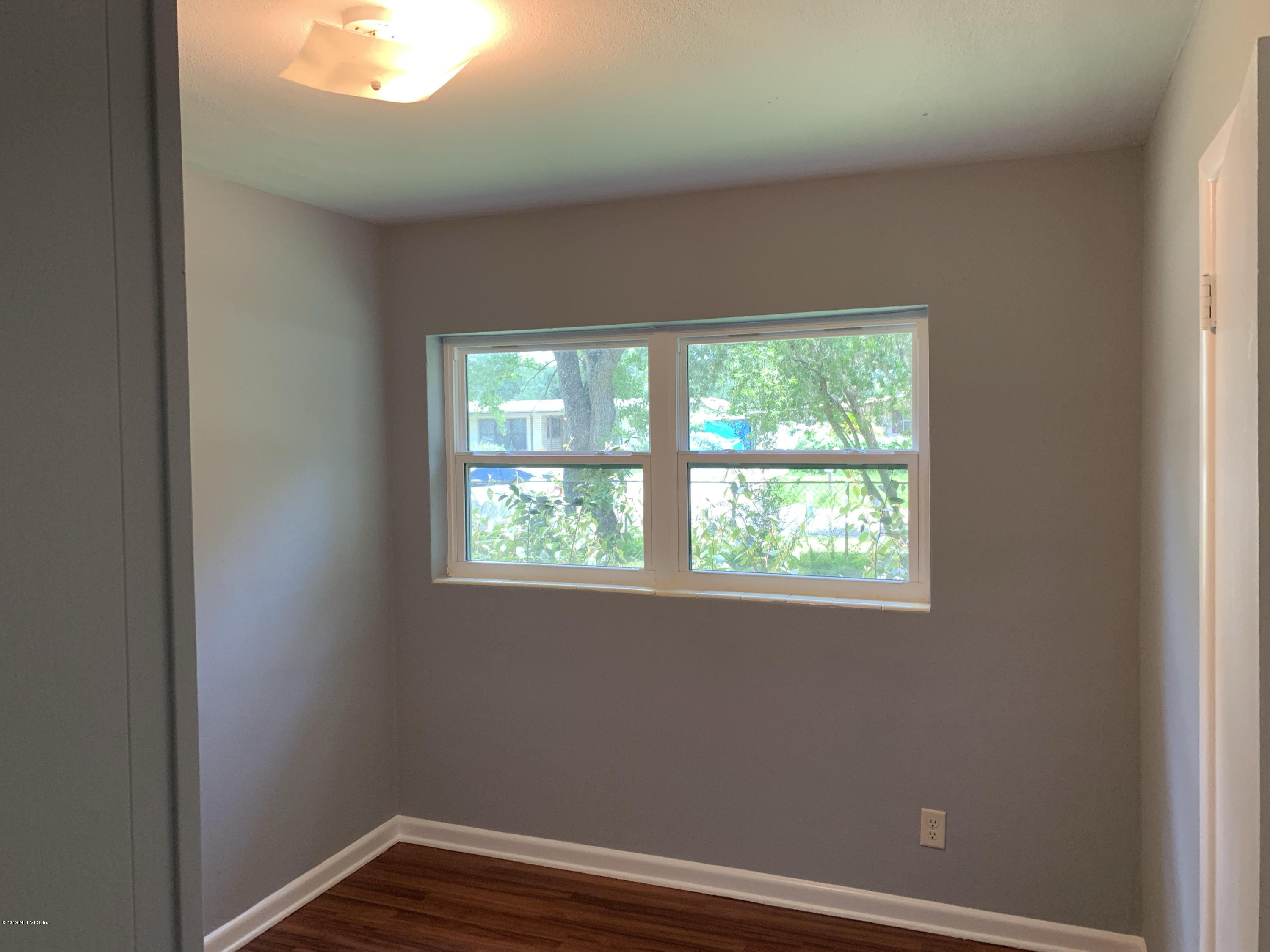 5304 Batley Road Jacksonville, FL 32210 - Photo 10 of 10 an empty room with a window